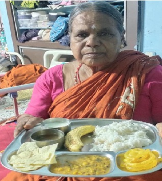 An elder woman with her served plate
