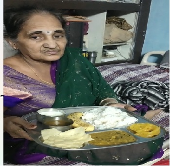 An elder woman with her served plate