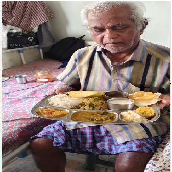 An elder woman with her served plate